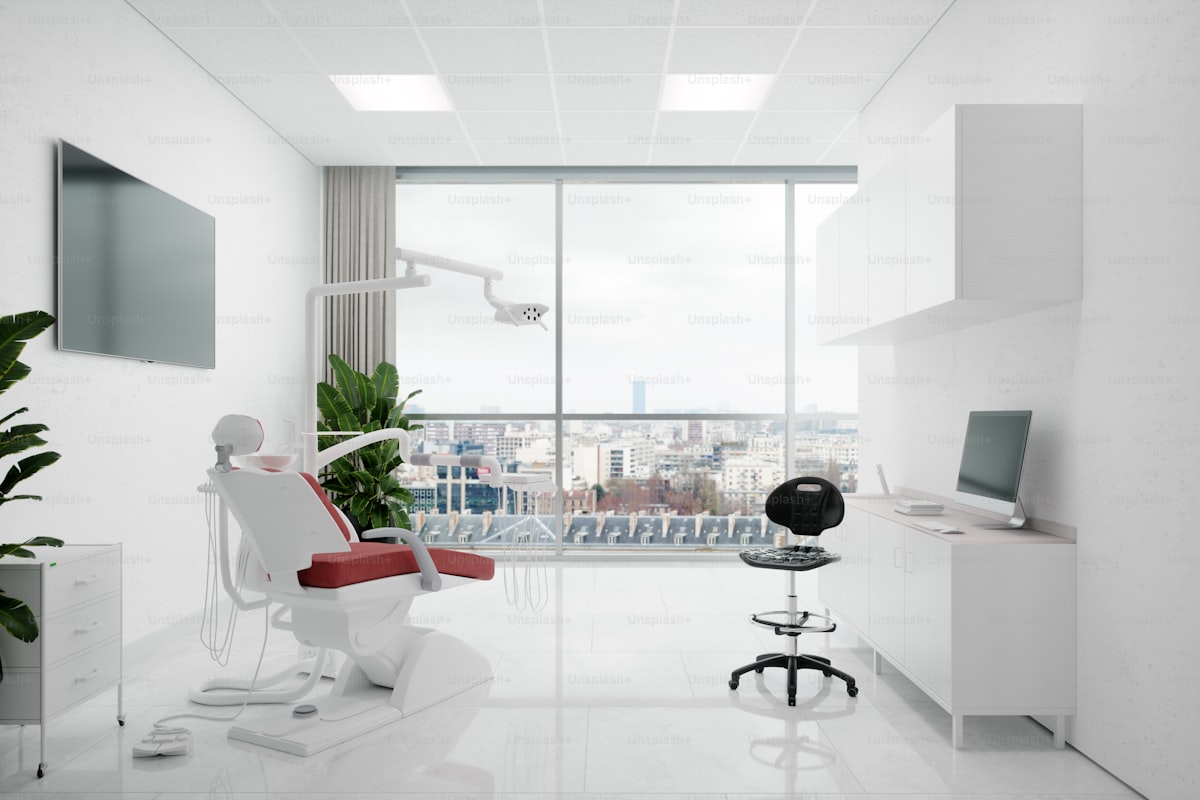 A consult room at Plain Medical with morning light, an examination chair, and a window onto the street.